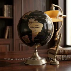 World globe decoration piece with metal base - black and gold on office desk table